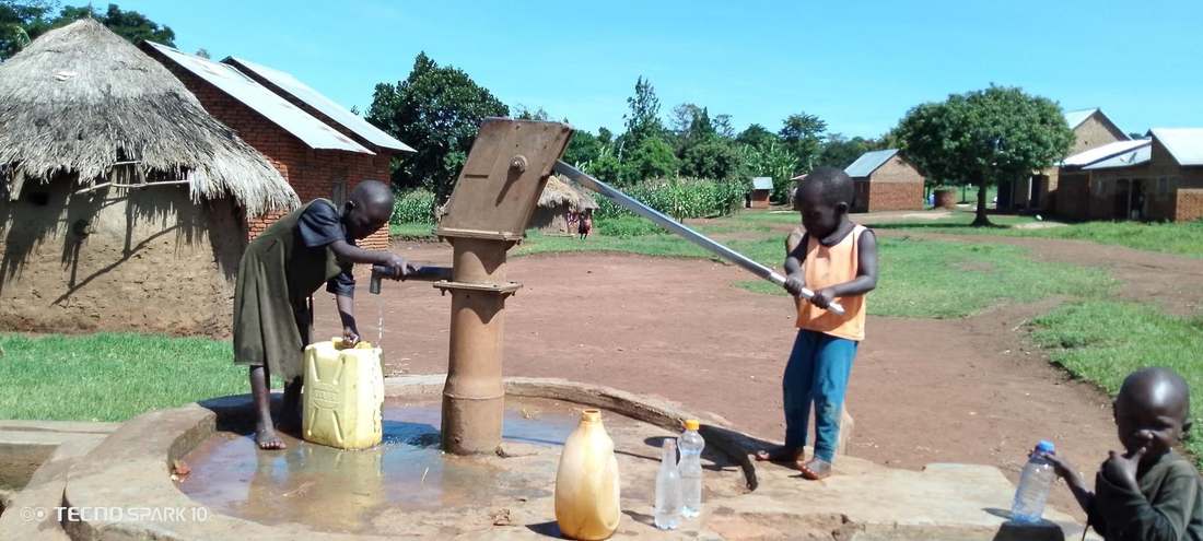 Children drawing water from a community well